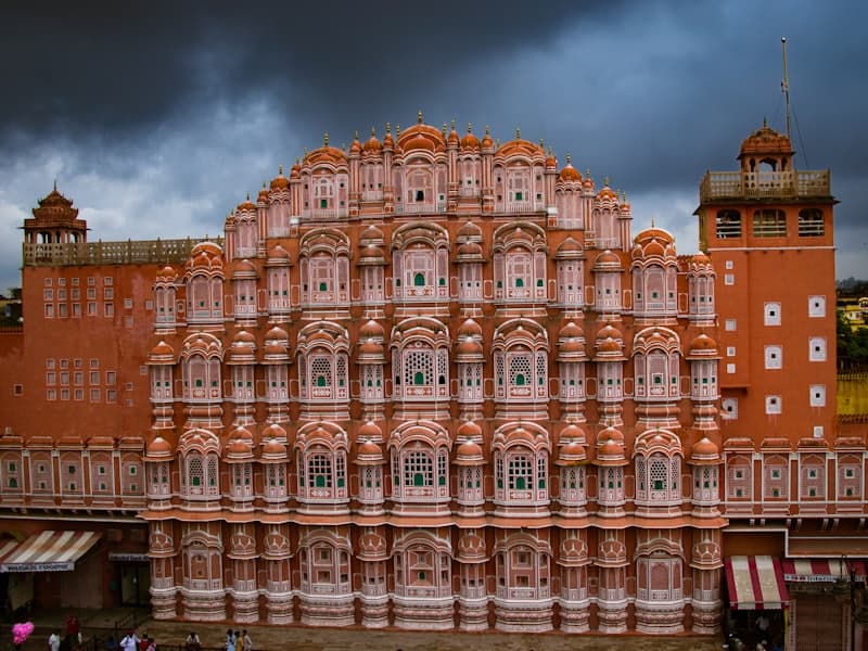 The pink sandstone facade of Hawa Mahal in Jaipur
